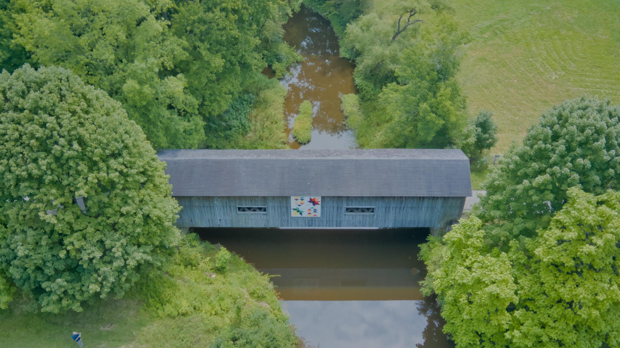 Top-down aerial view of South Denmark Road covered bridge and surrounding landscape